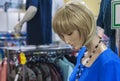 Female mannequin in a clothing store. Trading equipment - female plastic dummy