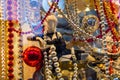 Female mannequin dressed in black lingerie and different christmas decorations in a showcase