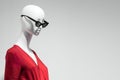 Female mannequin portrait in sunglasses and red dress. Sale and advertising theme. Copyspace for text Royalty Free Stock Photo