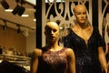 Female mannequins wearing sparkly evening dress.