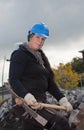 Female manual worker in blue hard hat