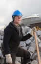 Female manual worker in blue hard hat