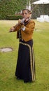 Female mariachi playing violin side shot