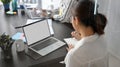 Female marketing officer working on laptop computer