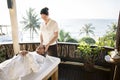 Female massage therapist giving a massage at a spa