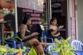 female masseuses are bored waiting for clients, and chat on the phone, thailand, Phuket, December 31, 2019