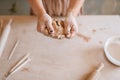 Female master shaping clay, pottery workshop