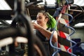 Female master smiling during repairing works in garage Royalty Free Stock Photo