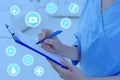 Female medical assistant with clipboard in clinic. Health care service