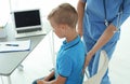 Female medical assistant examining child Royalty Free Stock Photo