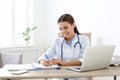 Female medical assistant at workplace Royalty Free Stock Photo