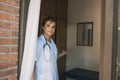 Nurse opening door in hospital