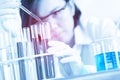 Female medical or scientific researcher using test tube on labor Royalty Free Stock Photo