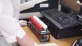 Female medical or scientific researcher using test tubes on laboratory. Clip. Female Scientist Analyzes Liquid in the Royalty Free Stock Photo