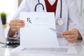 Female medicine doctor hand hold clipboard pad and give prescription to patient closeup. Panacea and life save Royalty Free Stock Photo