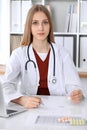 Female medicine doctor hand hold clipboard pad and give prescription to patient closeup. Panacea and life save Royalty Free Stock Photo