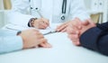 Female medicine doctor hand holding silver pen writing something on clipboard closeup Royalty Free Stock Photo