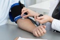 Female medicine doctor measuring blood pressure to patient Royalty Free Stock Photo