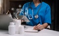 Female medicine doctor, physician or practitioner in lab room writing on blank notebook. Royalty Free Stock Photo