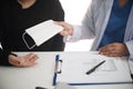 Female medicine doctor working on table with consulting patient Royalty Free Stock Photo