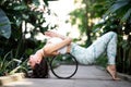 Female meditating and practicing yoga in tropical rainforest. Beautiful young woman practicing yoga outdoor with Royalty Free Stock Photo