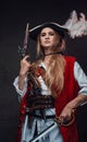 Female mercenary pirate with gun and sword
