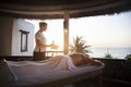 Female message therapist giving a massage at a spa