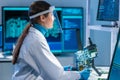 Female microelectronics engineer works in a scientific laboratory on computing systems and microprocessors. Professional