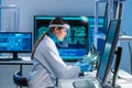 Female microelectronics engineer works in a scientific laboratory on computing systems and microprocessors. Professional