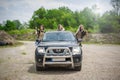 Female military security team with their jeep. Woman with weapon