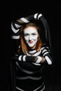 Female mime artist on black. Woman posing for a photo Royalty Free Stock Photo