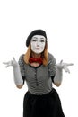 Female mime is confused. Vertical portrait, isolated on white Royalty Free Stock Photo