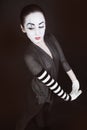 Female mime in gray jacket Royalty Free Stock Photo
