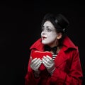 Female mime holding heart Royalty Free Stock Photo