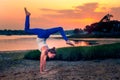 Female Model Adho Mukha Vrksasana Variation Handstand Beach