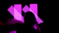 Female model against digital wall. Woman silhouette dancing in front of digital screen wall with neon strobing symbols