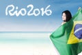 Female model with Brazilian flag at coast Royalty Free Stock Photo