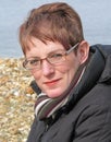 Female model with glasses posing on beach Royalty Free Stock Photo