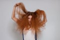 Female model playing with frizzy hair Royalty Free Stock Photo