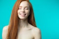 Female model with red loose hair and natural make-up posing over Royalty Free Stock Photo