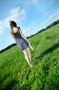 Woman walking in meadow Royalty Free Stock Photo