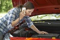 Female Motorist Phoning For Help After Breakdown