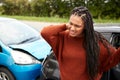 Female Motorist With Whiplash Injury In Car Crash Getting Out Of Vehicle Royalty Free Stock Photo