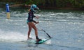 Female Motosurf Competitor moving at speed.