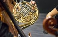 Female musician playing french horn duriing a live orchesta performance Royalty Free Stock Photo