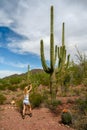 Female nature photographer taking photos of the saguaro cactus Carnegiea gigantea in Saguaro National Park, Arizona Royalty Free Stock Photo