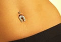 Female navel with piercing Royalty Free Stock Photo