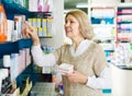Female near counter in pharmacy