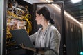 Female Network Technician Connecting Cables