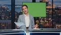 Female news presenter reporting in broadcasting studio. Positive woman talking Royalty Free Stock Photo